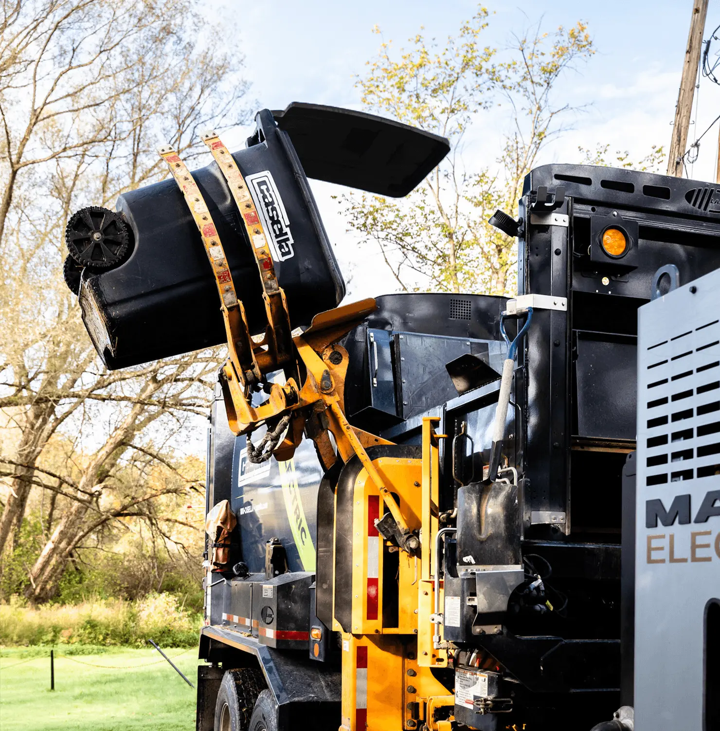 Casella truck lifting residential garbage cart